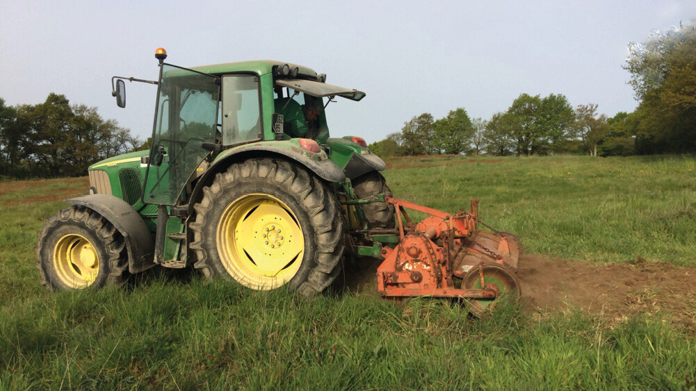 Tractor plowing farmland. Protect buried infrastructure from third-party interference with AP Sensing fiber optic monitoring Tractor plowing farmland. Protect buried infrastructure from third-party interference with AP Sensing fiber optic monitoring