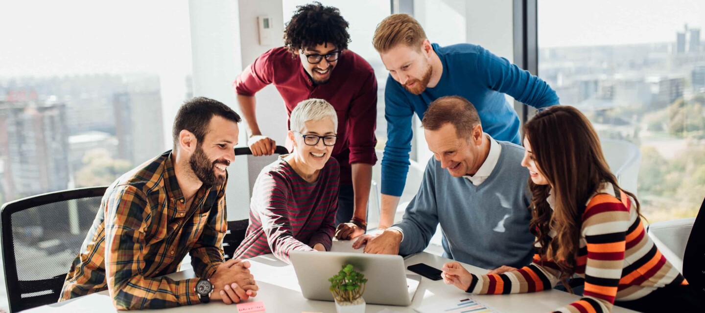 Employees working together at one table