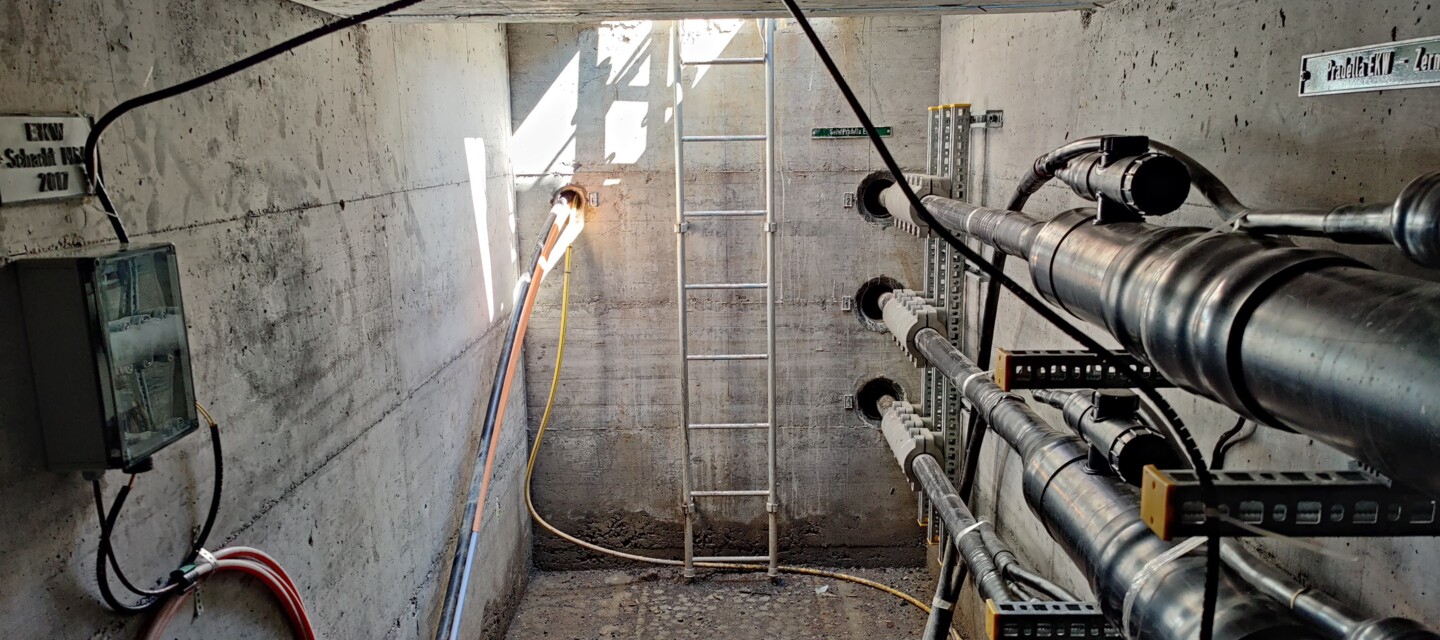 Infrastructure tunnel with power cables, showcasing assets monitored by AP Sensing's distributed fiber optic sensing solutions Infrastructure tunnel with power cables, showcasing assets monitored by AP Sensing's distributed fiber optic sensing solutions