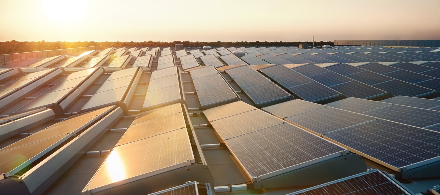 Extensive rooftop solar panel installation at sunset for reliable asset protection Extensive rooftop solar panel installation at sunset for reliable asset protection