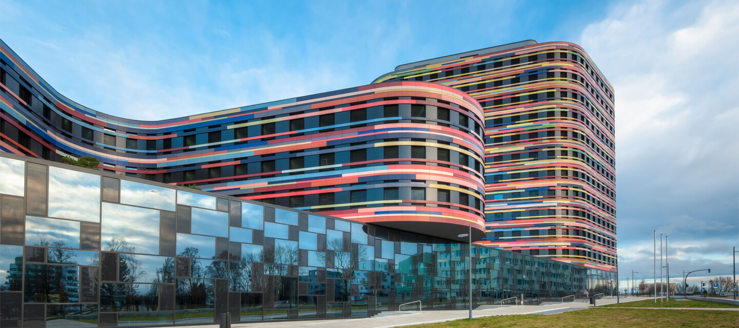 Modern, colorful building facade illustrating environments suitable for AP Sensing's fiber optic monitoring solutions Modern, colorful building facade illustrating environments suitable for AP Sensing's fiber optic monitoring solutions