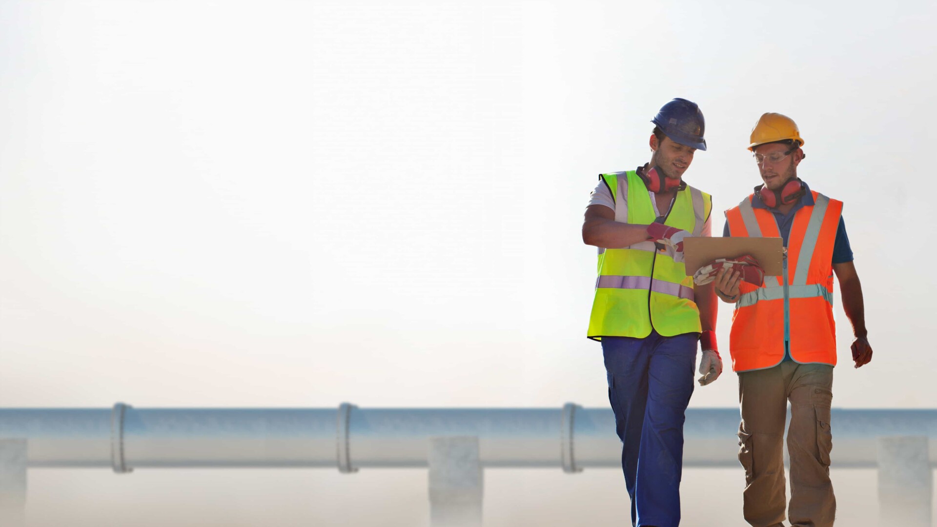 Engineering team in front of a pipeline