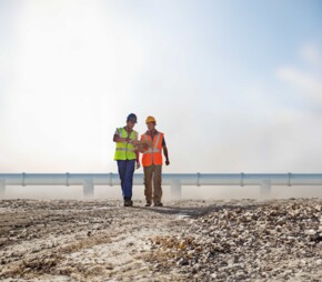 Engineering team in front of a pipeline