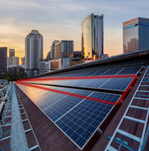 Rooftop solar panels with red lines showing the fiber optic cable for monitoring