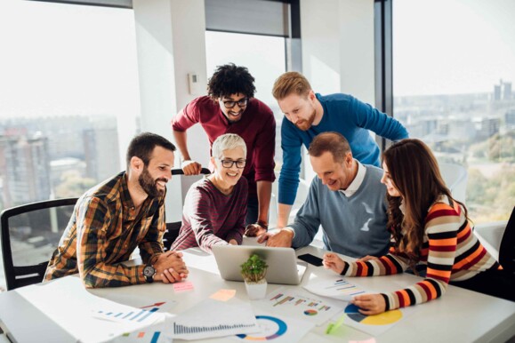 Employees working together at one table