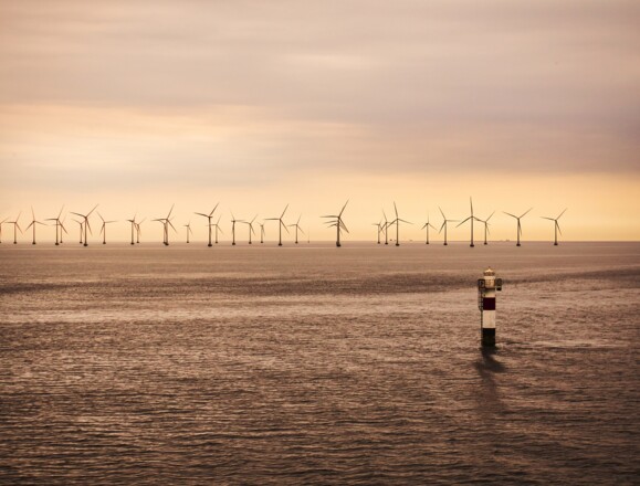 Offshore wind farm infrastructure in the sea, requiring reliable fiber optic sensing solutions for asset monitoring Offshore wind farm infrastructure in the sea, requiring reliable fiber optic sensing solutions for asset monitoring