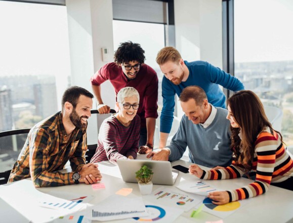 Employees working together at one table