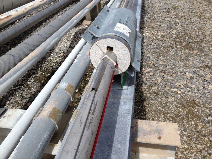 Fiber optic sensing installation on pipes, demonstrating AP Sensing infrastructure monitoring solutions Fiber optic sensing installation on pipes, demonstrating AP Sensing infrastructure monitoring solutions