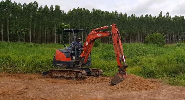 Mini excavator digs, site preparation for assets needing distributed fiber optic monitoring solutions Mini excavator digs, site preparation for assets needing distributed fiber optic monitoring solutions
